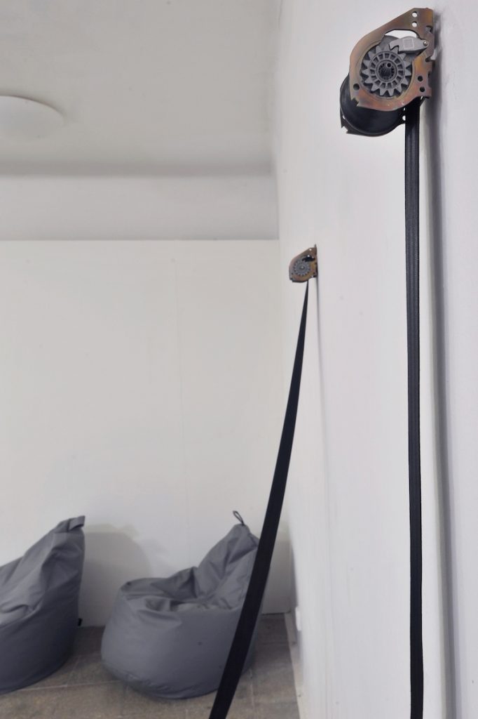 Veronika Olejárová: Fasten your seatbelts! Installation, 2023. Fatboys, winding mechanism for car seatbelts, plaster object. Photo: Pavel Petrov, OGV Jihlava.